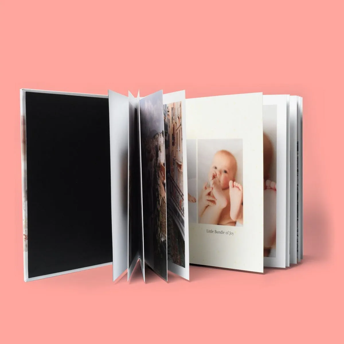 Open layflat photo book with thick pages fanned out